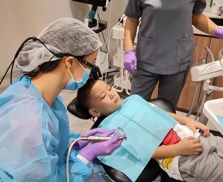 Child receiving gentle dental care