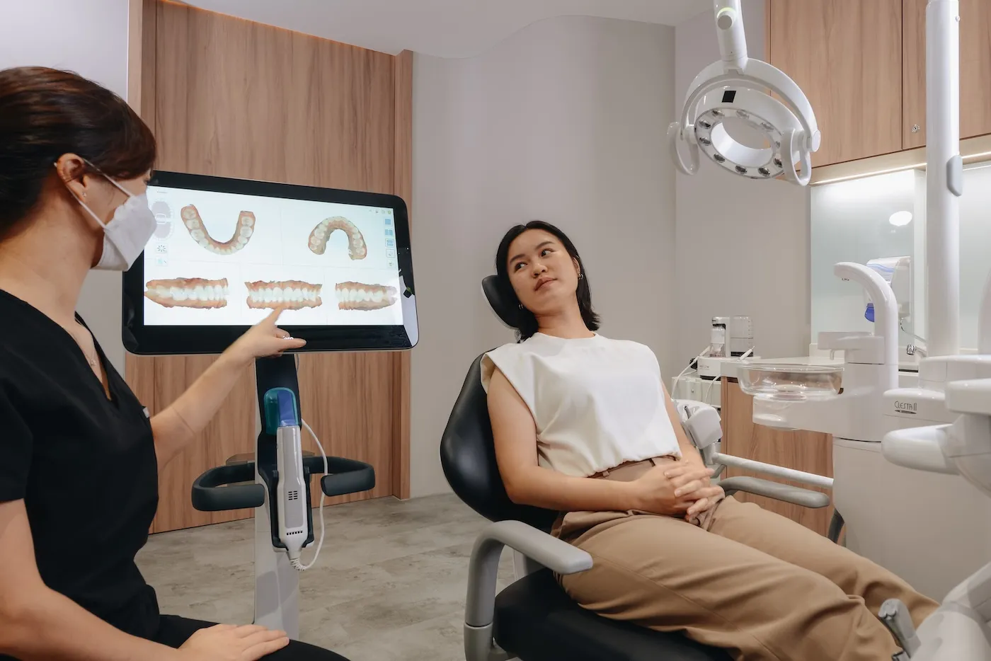 Dentist reviewing 3D scan with patient