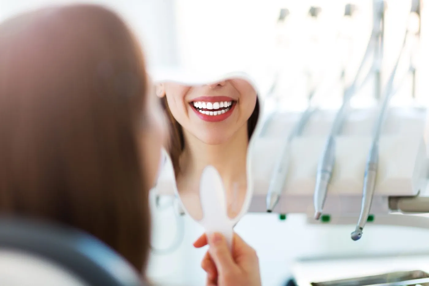 Smiling patient checking shade